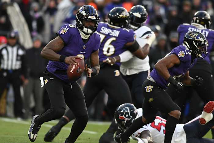 Jan 20, 2024; Baltimore, MD, USA; Baltimore Ravens quarterback Lamar Jackson (8) runs the ball against the Houston Texans in the first quarter of a 2024 AFC divisional round game at M&T Bank Stadium.